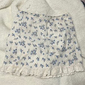 Emory park white shirt with blue flowers and ruffle at bottom
